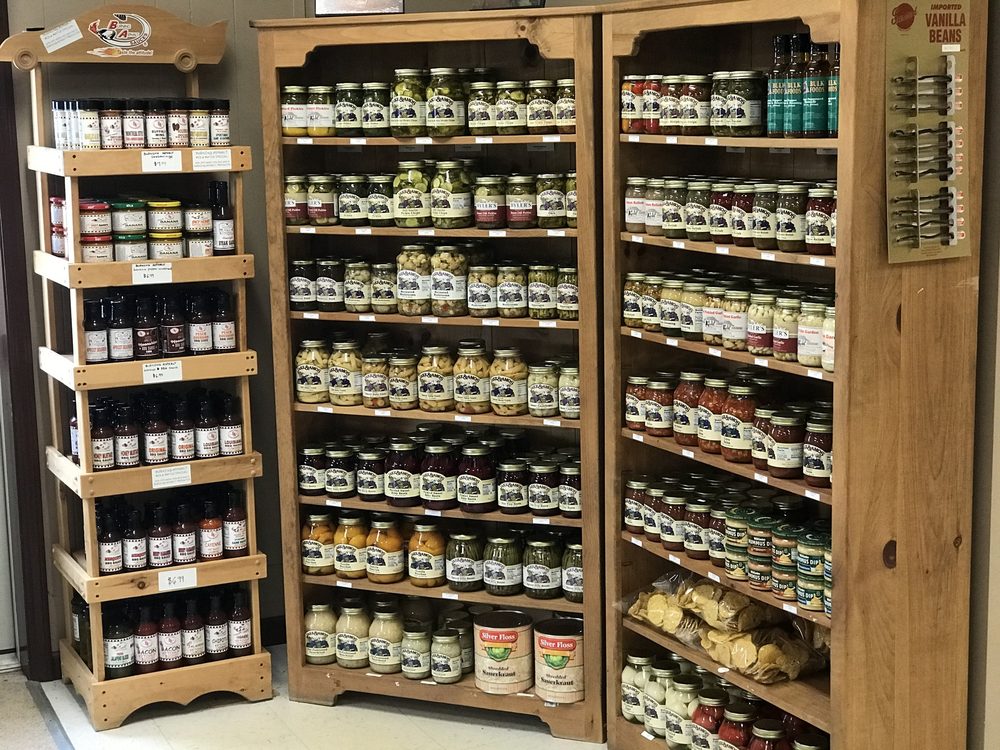 Jars of pickles, sauces and imported vanilla beans on the shelves